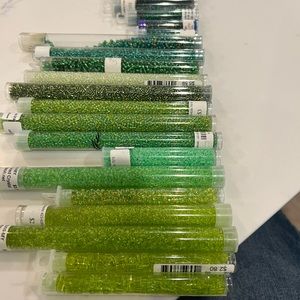 Various green glass beads